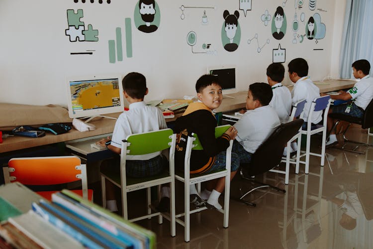 Children Sitting Inside The Classroom