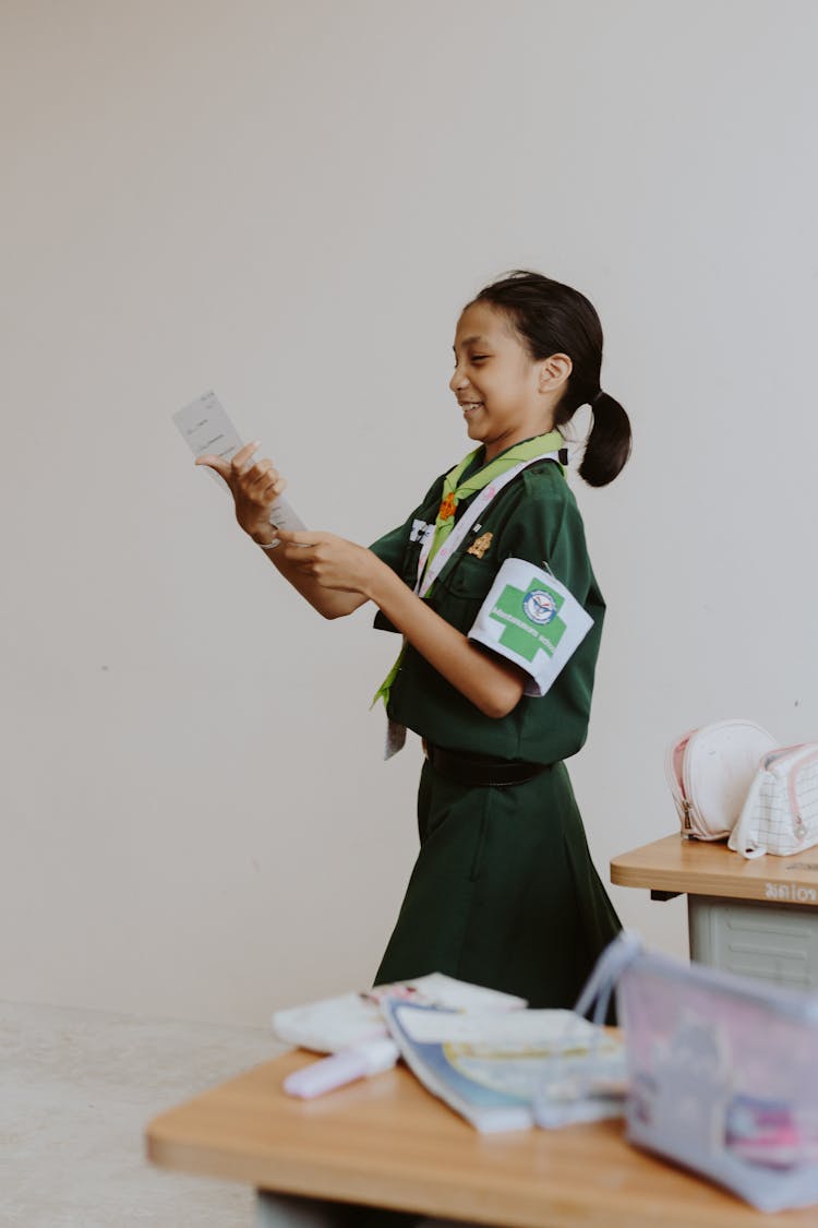 Thai School Girl With Ponytail Holding Exam 