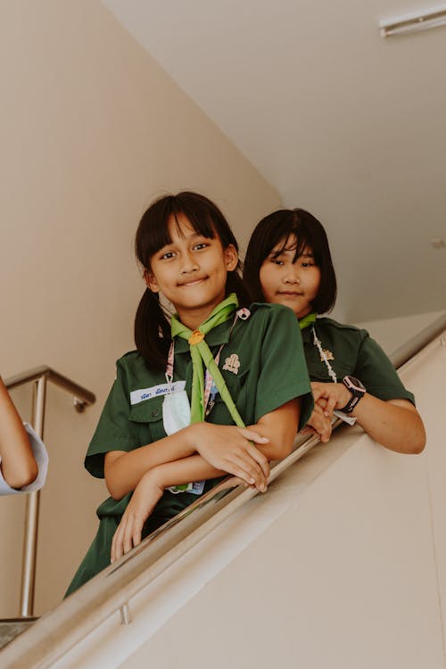 Close-Up Shot of Girls in Uniforms Smiling