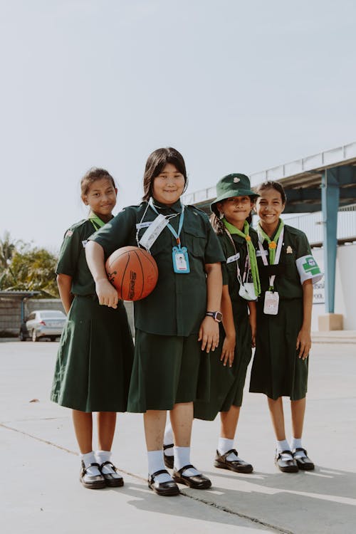 Four Girl Scouts in Their Green Uniform