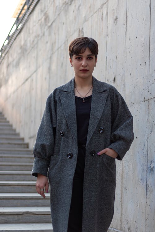 A Woman in Black Coat Standing