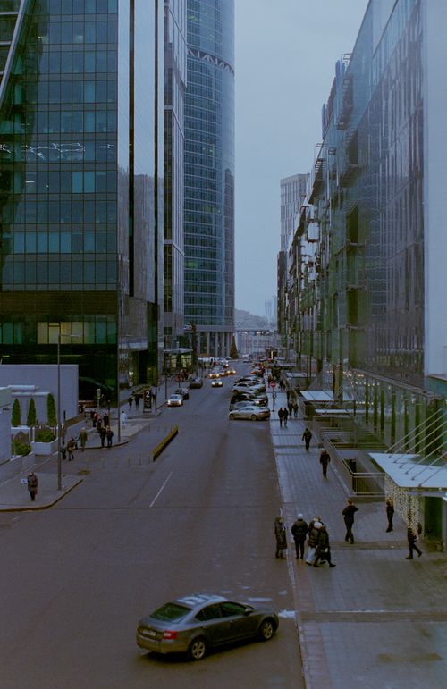 Free High-rise buildings along a bustling street in central Moscow, Russia, showcasing urban life. Stock Photo