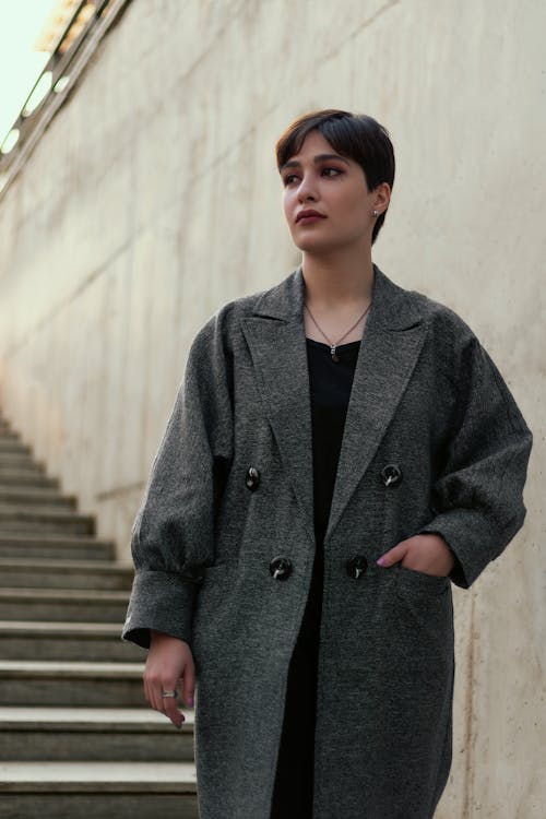 A Woman in Black Coat Standing