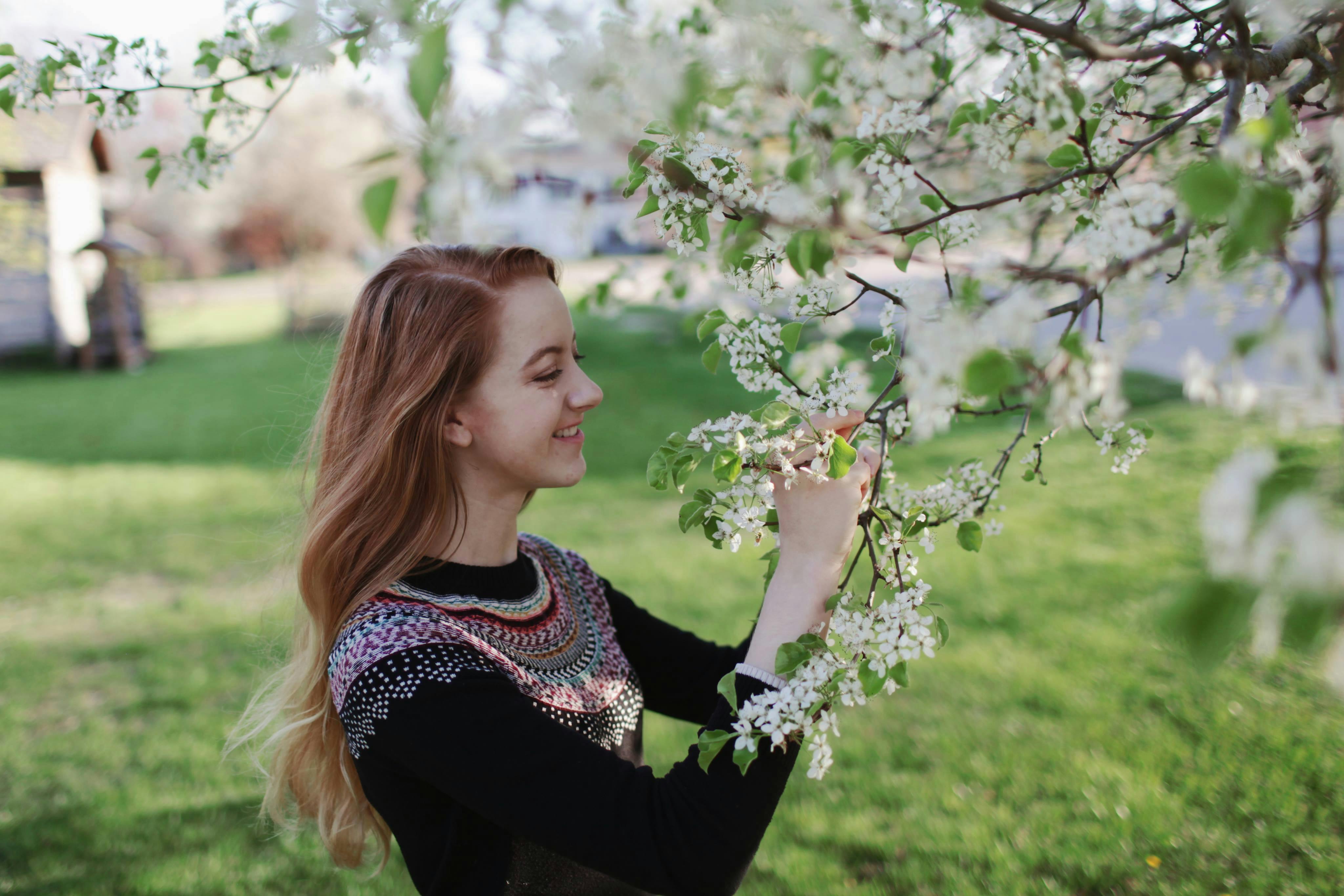 Woman in Dress Standing Beside Tree · Free Stock Photo