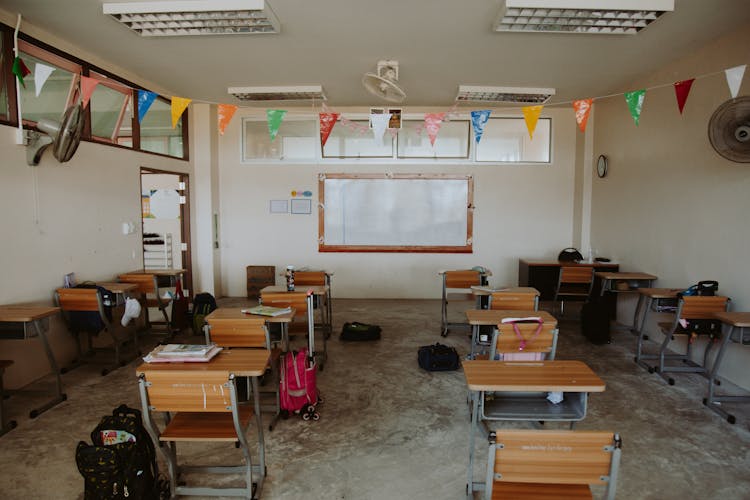 Rows Of Chairs And Desks In Empty Classroom