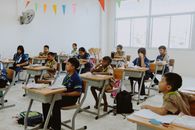 Children Sitting on School Chairs