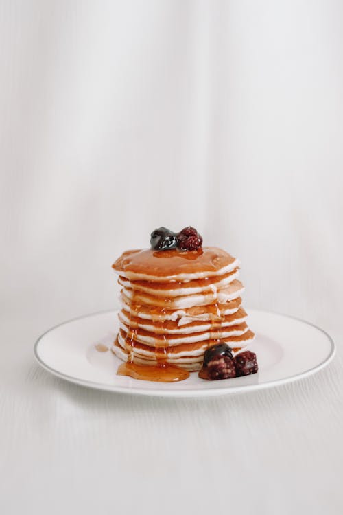 Free Close-Up Shot of a Stack of Pancakes on a Plate Stock Photo