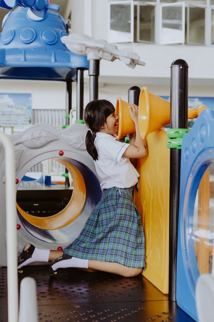 Girl In School Uniform Playing In School Gymnasium