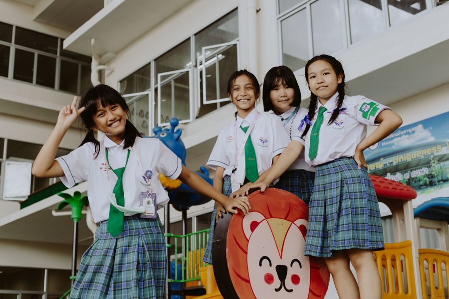 Children in uniform with house ties posing playfully