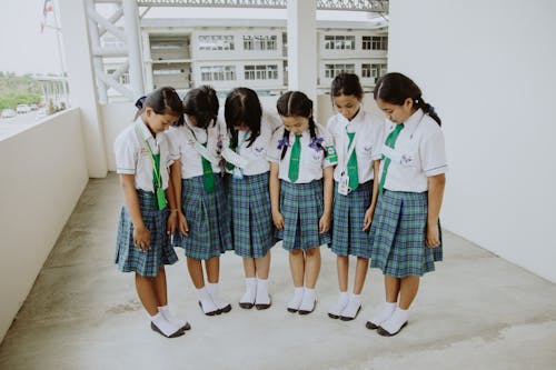 Free Girls in School Uniforms Standing on Terrace Stock Photo