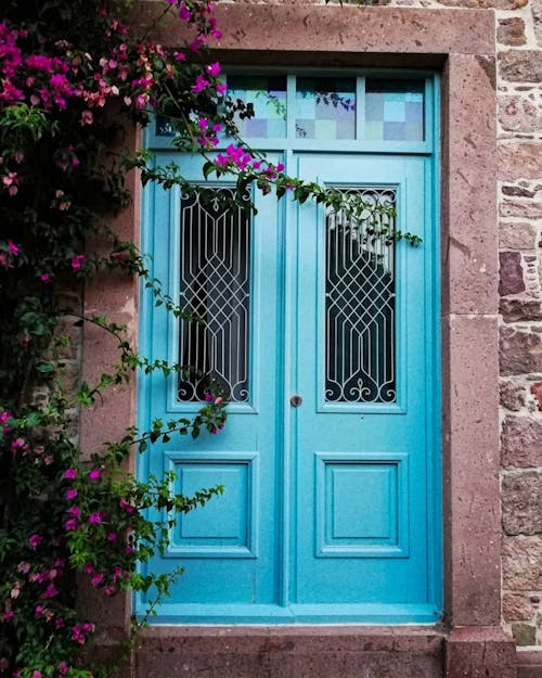 Blue Wooden Door With Pink Flowers