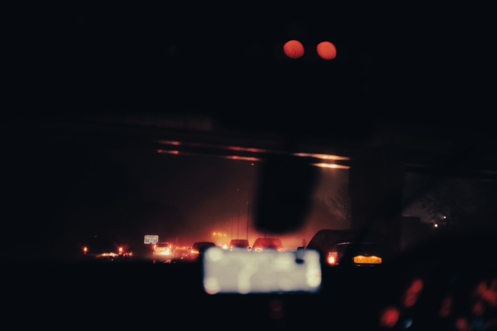 Vehicle lights on a highway at night — photo by urtimud.89 on Pexels