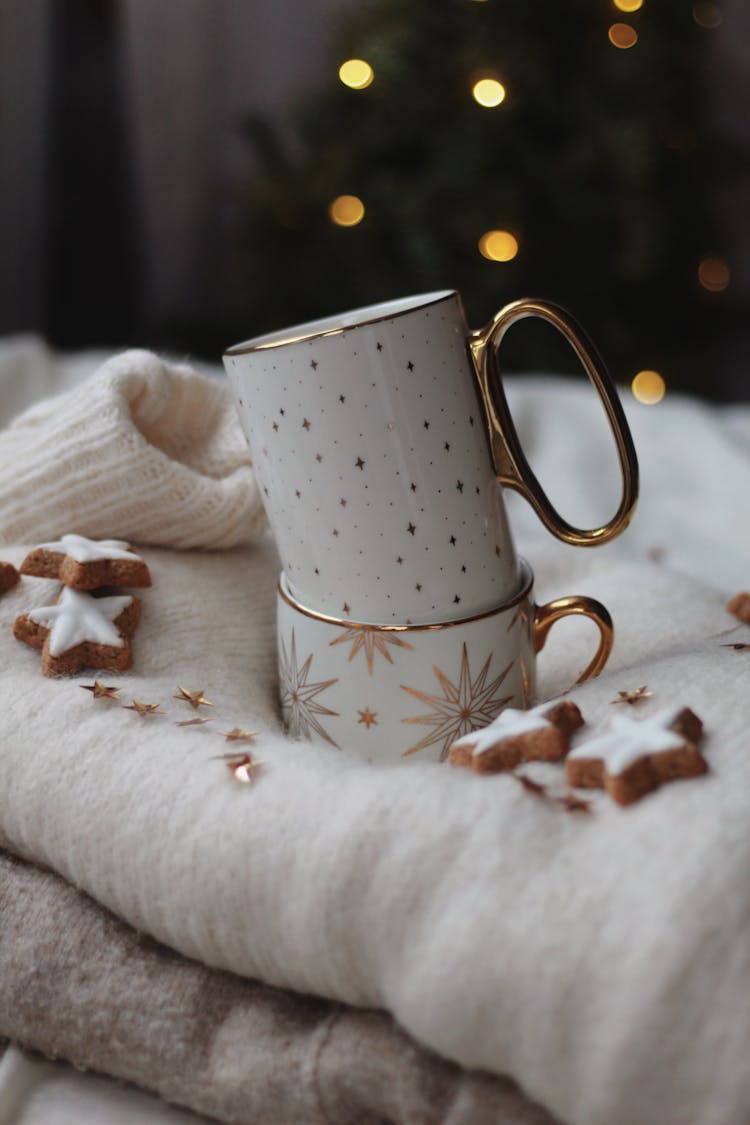 Two Mugs And Cookies On Blanket