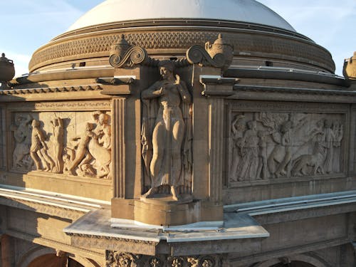 Photo of Sculptures and Statues of a Building with Dome