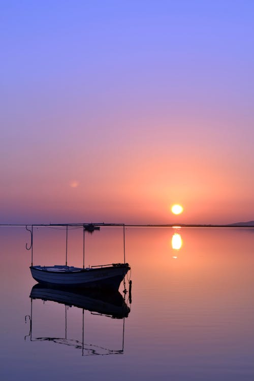 Boat on Sea during Sunset