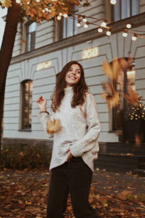 A Woman in Turtle Neck Sweater and Black Pants