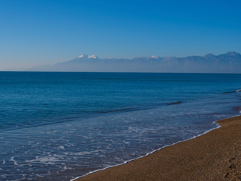 Calm Waves on the Beach Sand