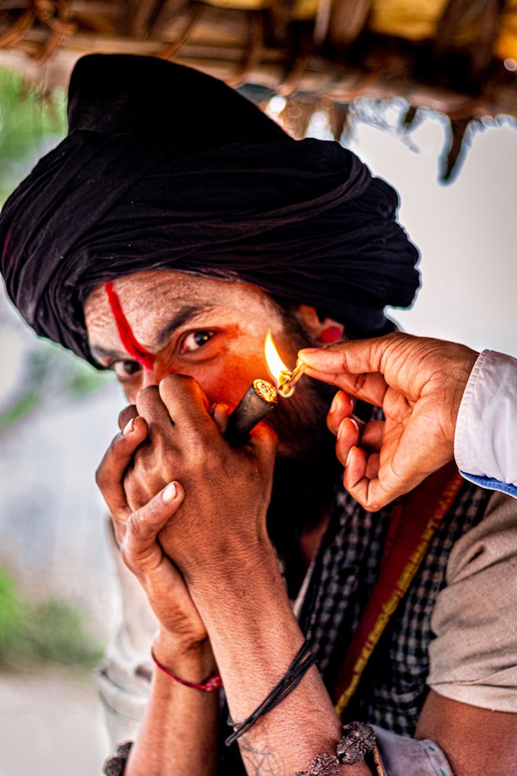 A Man Smoking A Cigar