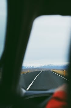 A mesmerizing drive with mountains in the distance, capturing a sense of adventure.