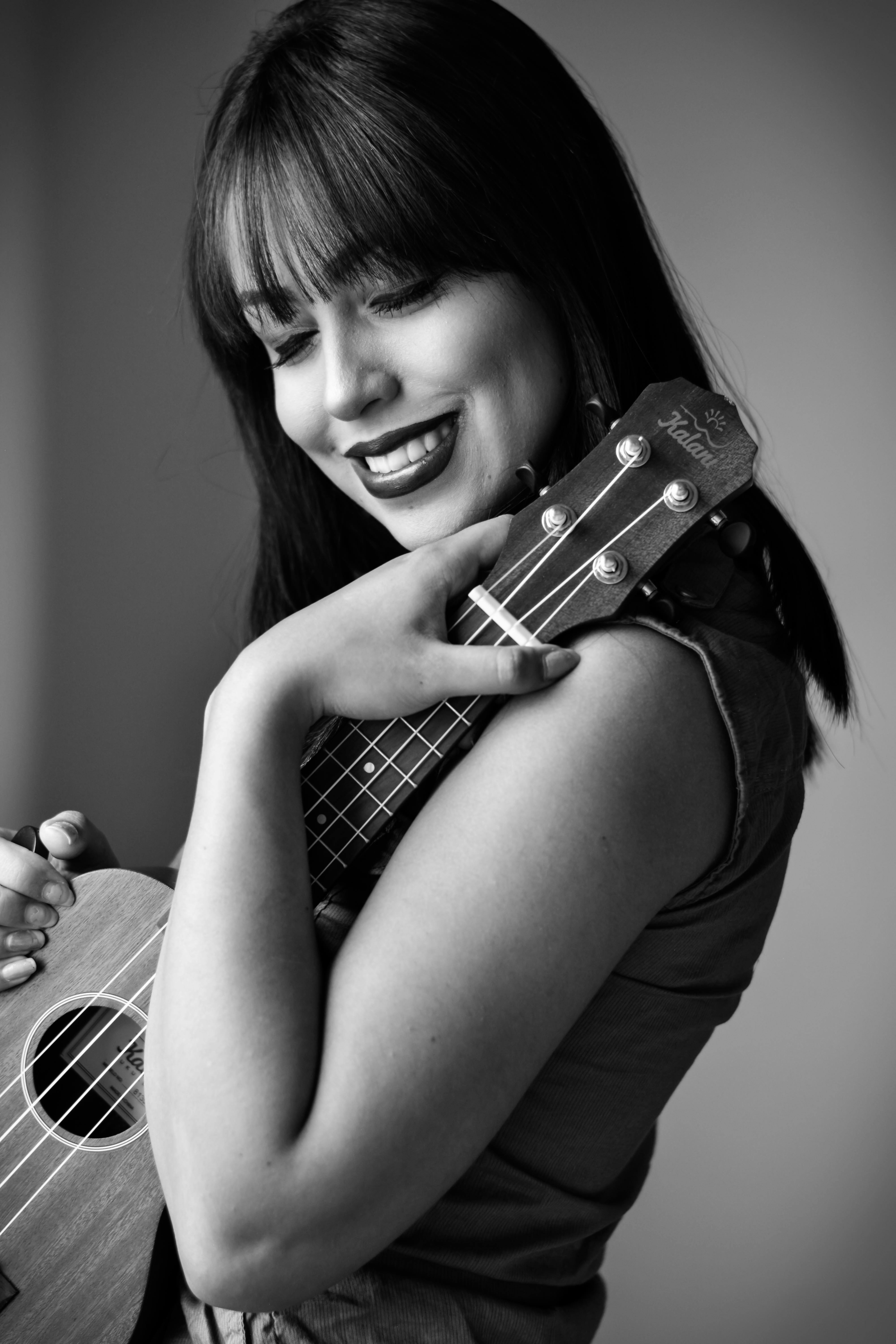 Greyscale Photo of Woman Holding Ukulele