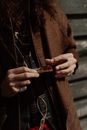 Hands Holding a Roll Cigarette