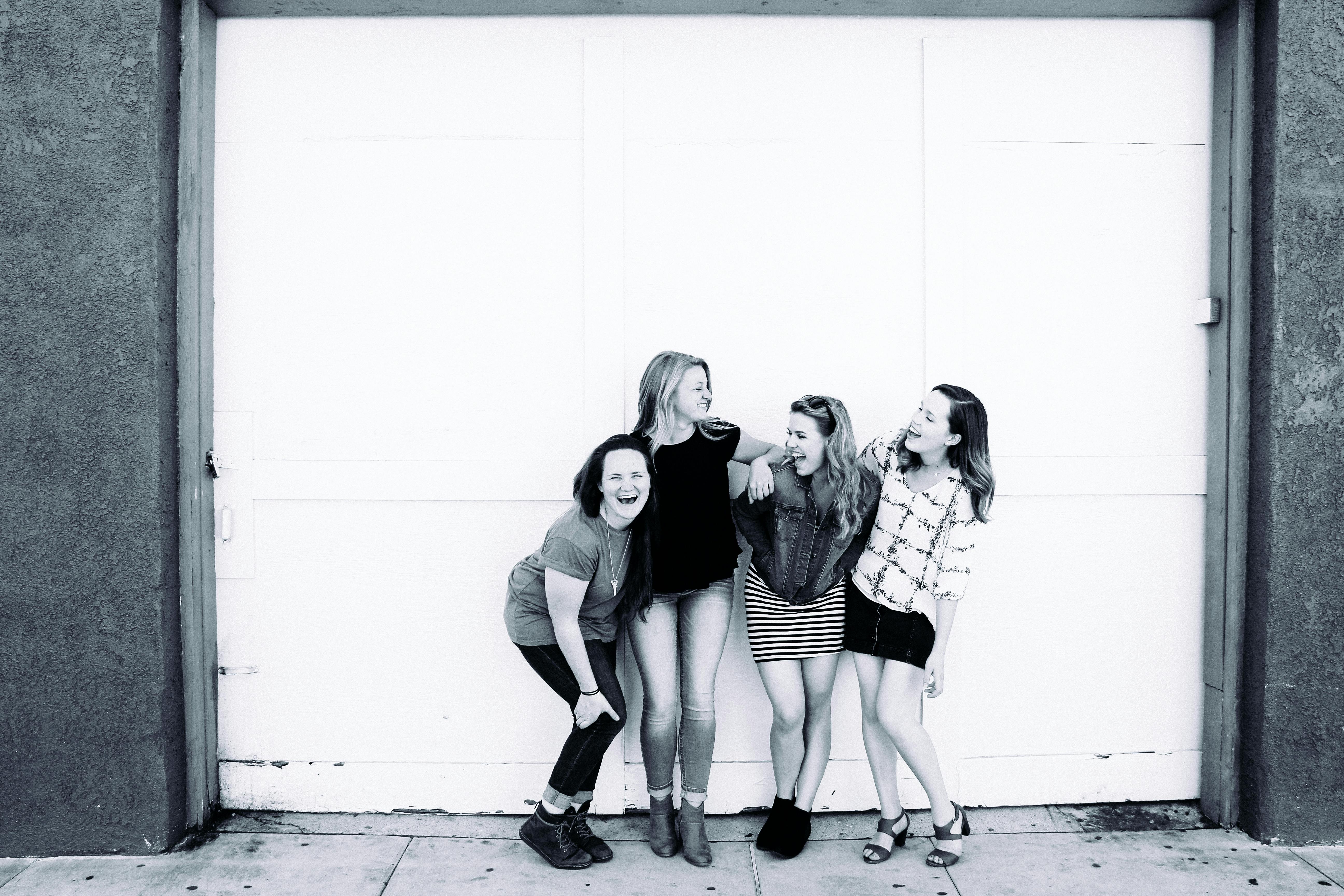 Grayscale Photography Of Four Women Wearing Clothes Free Stock Photo