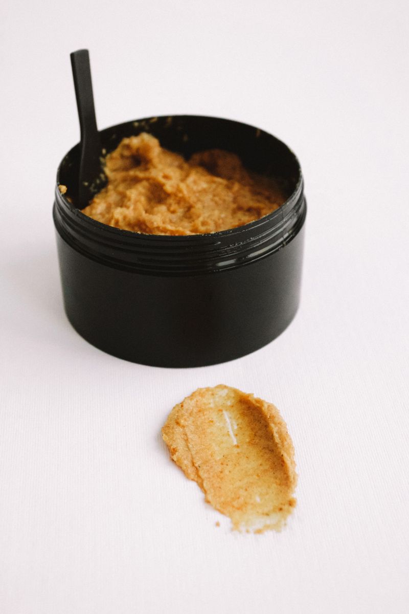Natural body scrub in a black jar
