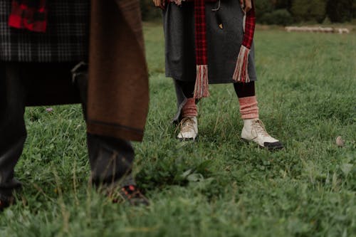 Couple Wearing Bohemian Clothes on a Field 