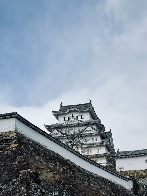 Free Explore the iconic Himeji Castle, a masterpiece of Japanese architecture, captured from below. Stock Photo