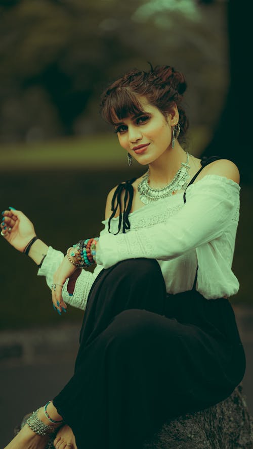 Woman in White Long Sleeve Shirt and Black Pants