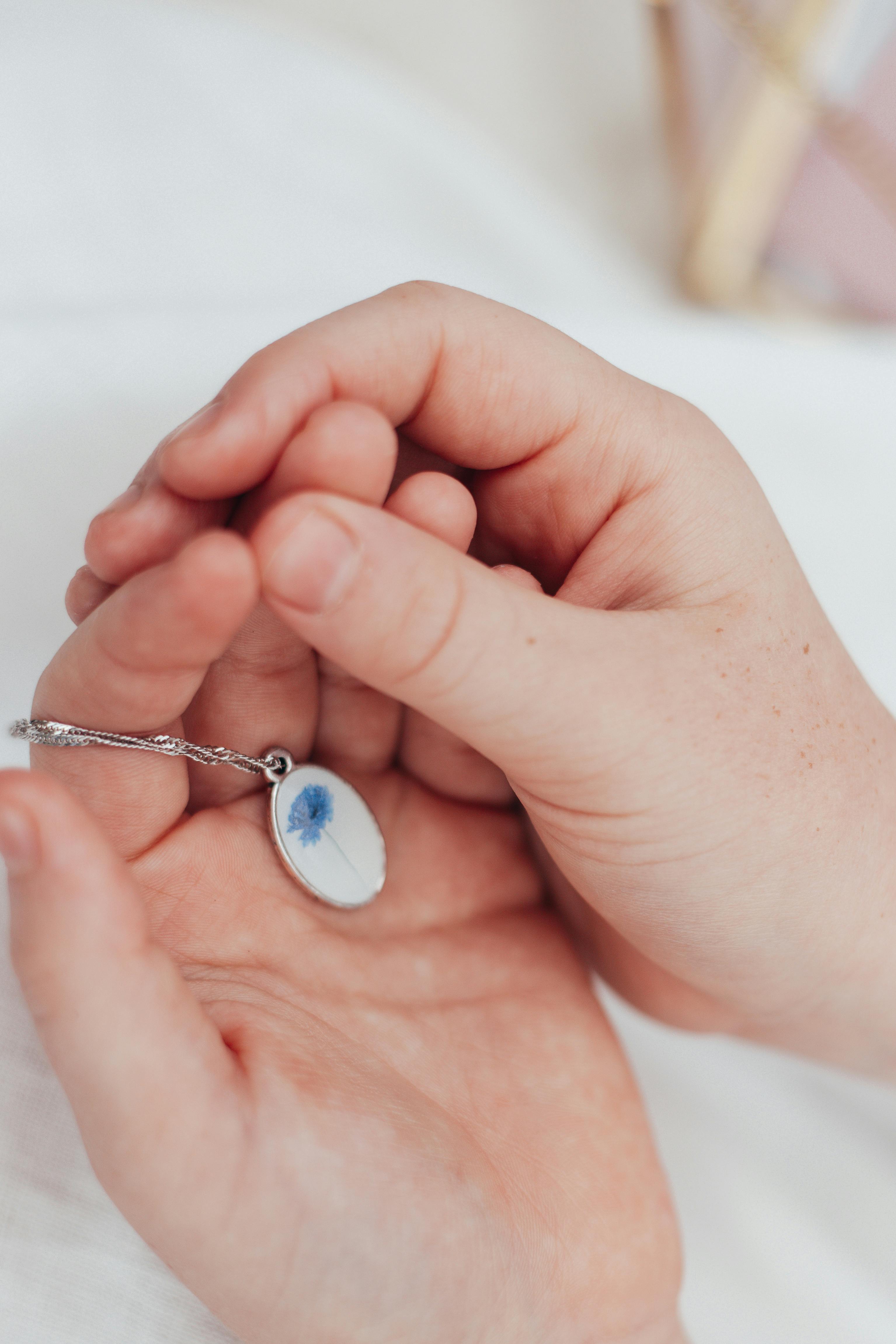 pendant in the hands