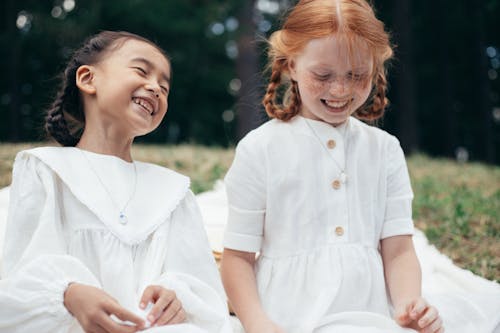 Free Two Happy Girls in White Dresses Stock Photo