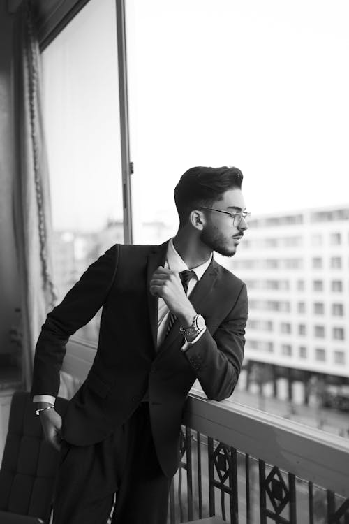 Grayscale Photo of a Man in Black Suit