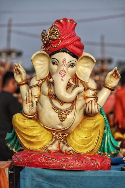 Free Colorful statue of Hindu deity Ganesh with traditional attire, promoting spirituality and culture. Stock Photo
