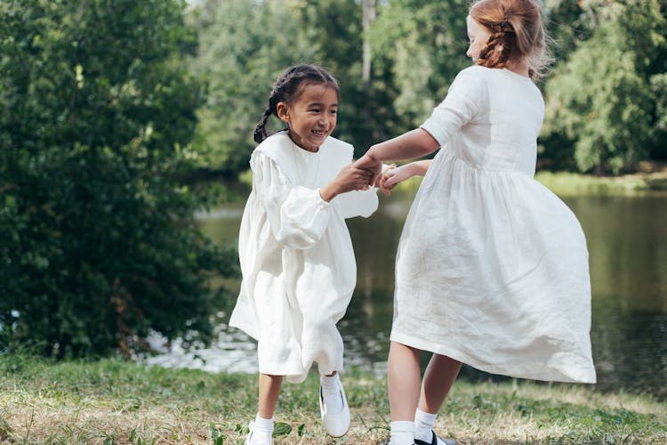 Girls Dancing While Playing In Park