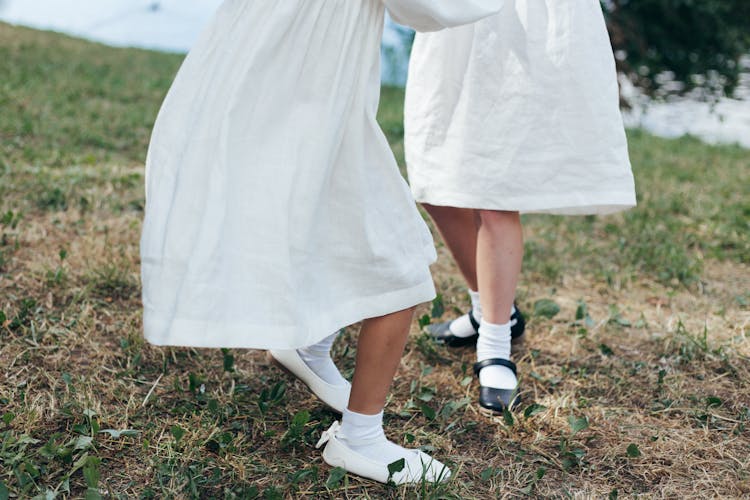 Legs Of Two Girls In Park