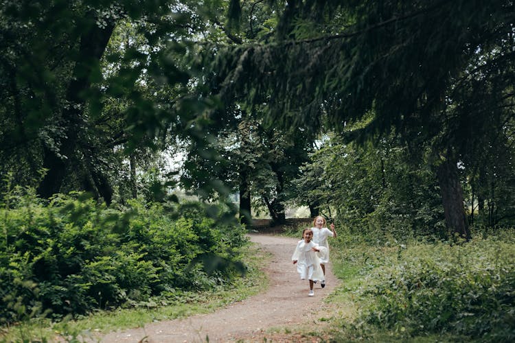 Girls Wearing White Dresses Running