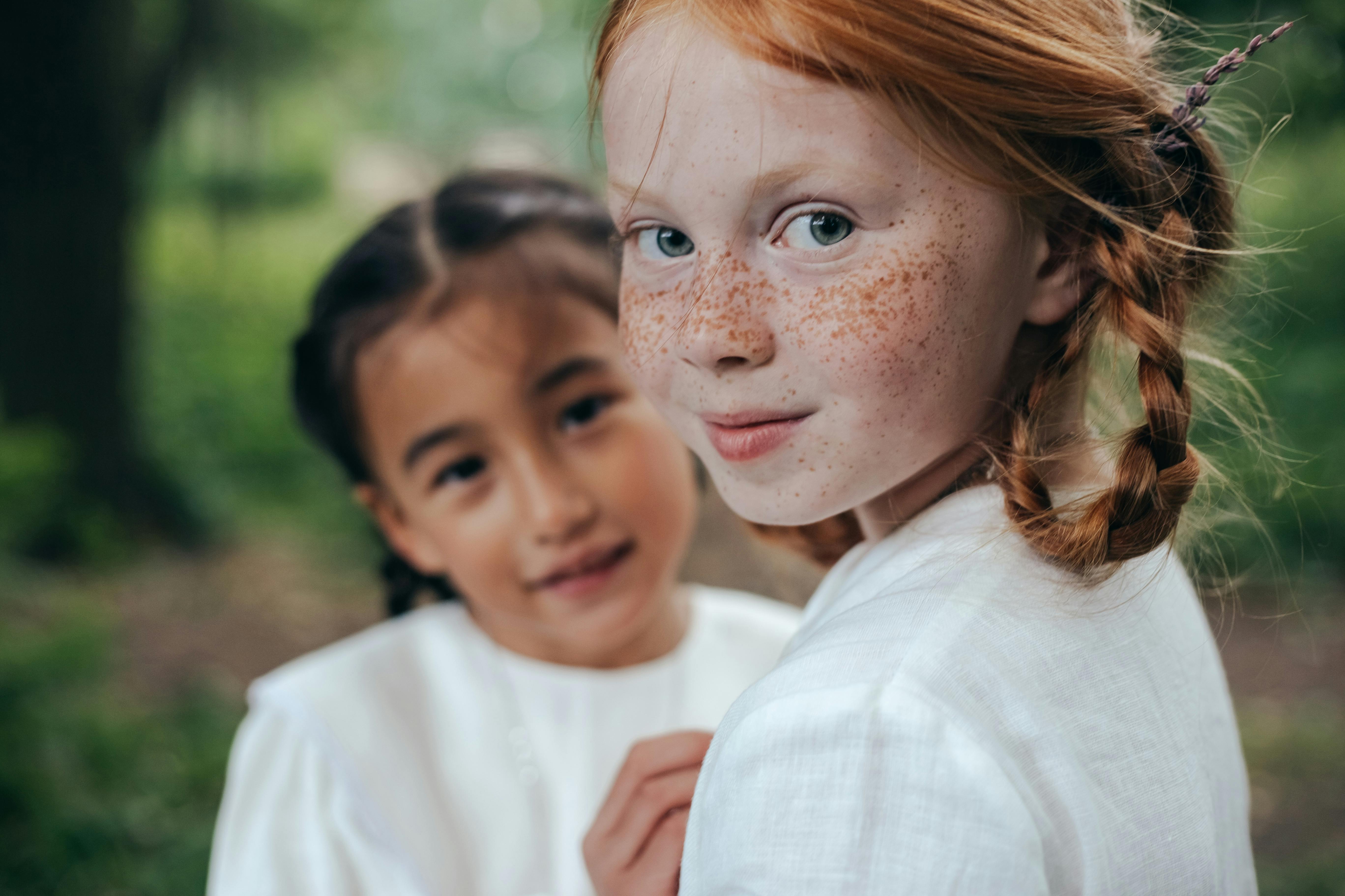 Close up shot of two girls smiling