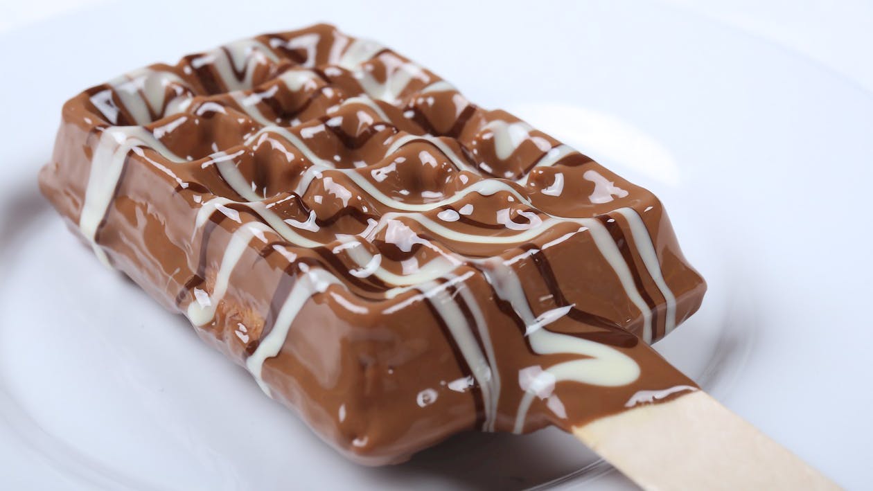 Close Up Photo of Chocolate Ice Cream on Stick