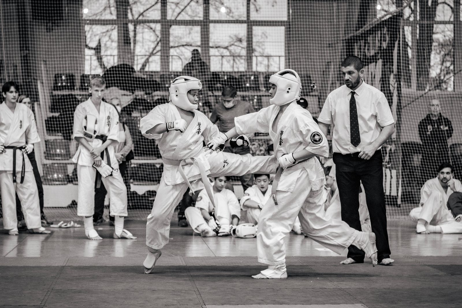 Karate bout in a packed competition arena