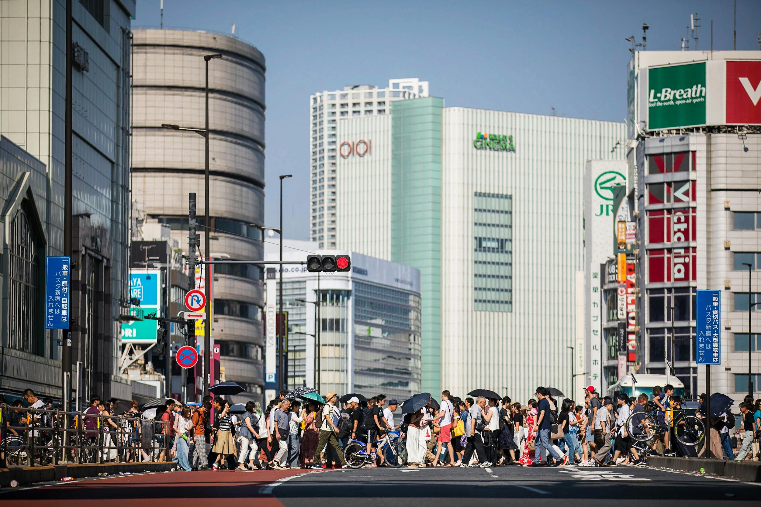 people crossing street in city