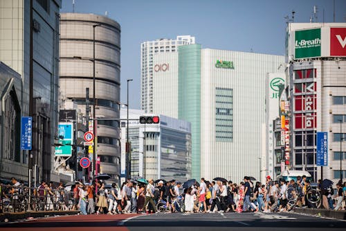 People Crossing Street in City