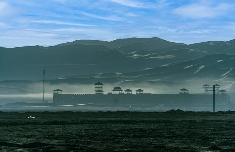 Fortress In Mountains On Foggy Day