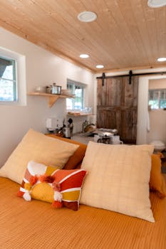 Warm and inviting A-frame bedroom with rustic decor and modern amenities.