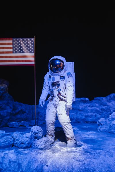 A figure in a pressure suit on a grey lunar plain — photo by Deybson Mallony on Pexels