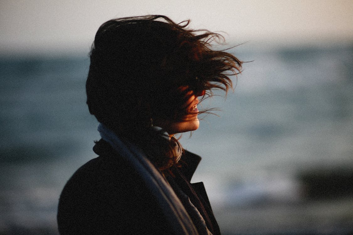 Womans Hair Blowing in Wind · Free Stock Photo