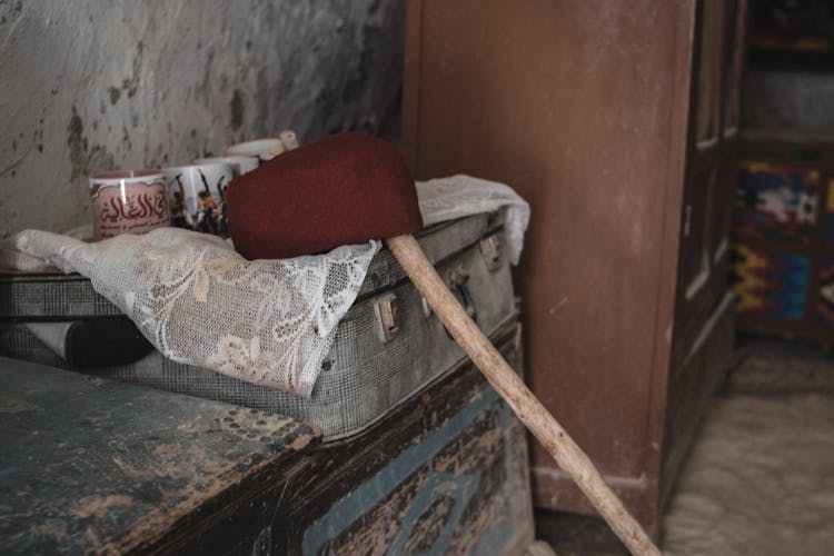 Old Suitcase And Furniture In A Storage Room 