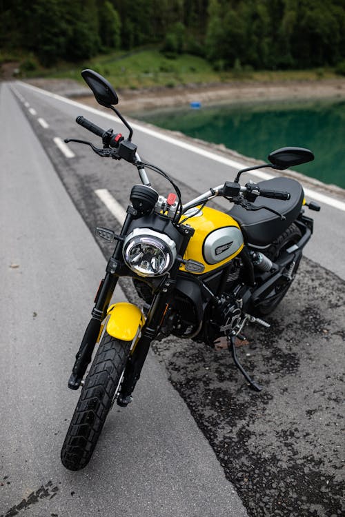 Free Yellow and Black Motorcycle on the Road Stock Photo