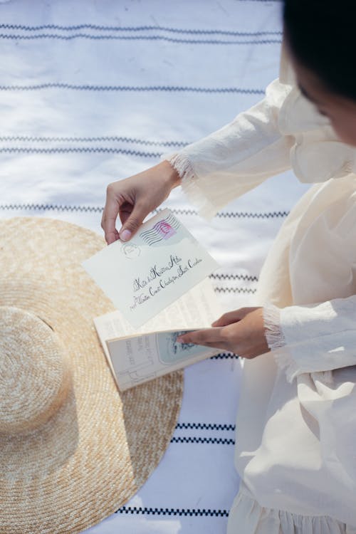 Overhead View of Woman Holding Letter