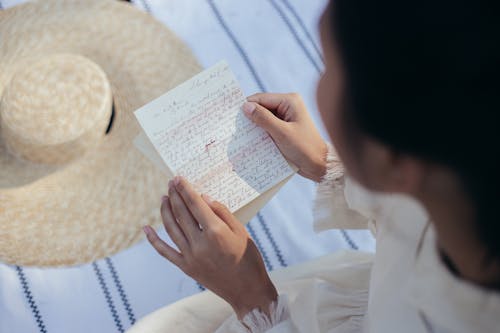 Overhead View of Woman Reading Letter